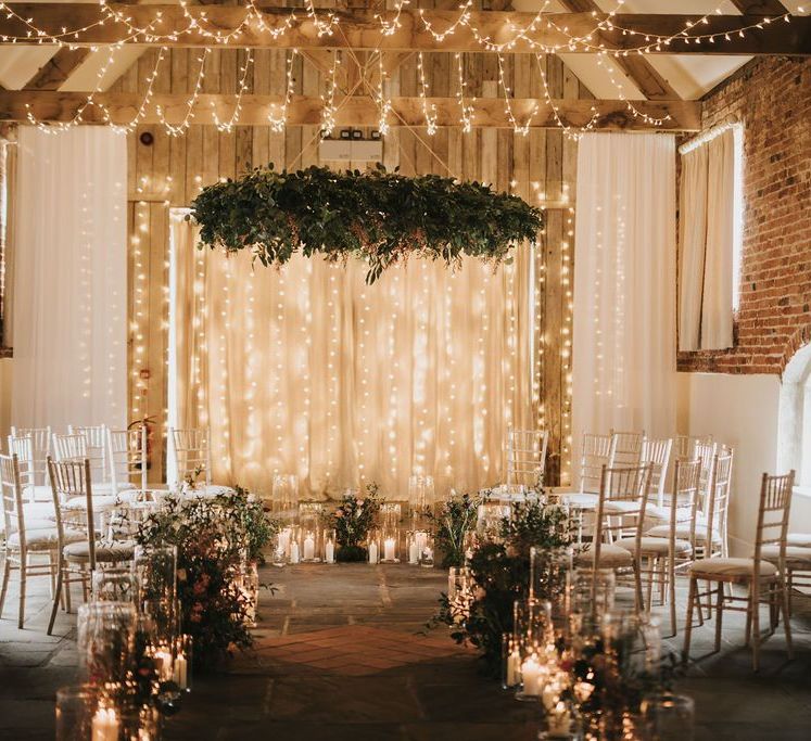 Healing Manor wedding ceremony with fairy light backdrop