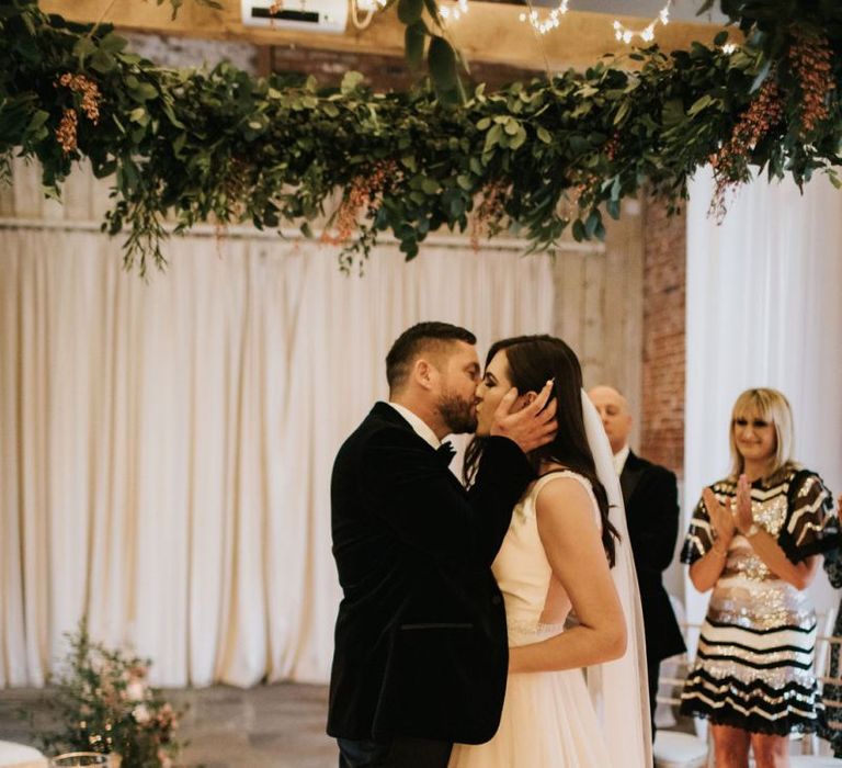 Bride and groom kiss at Healing Manor wedding