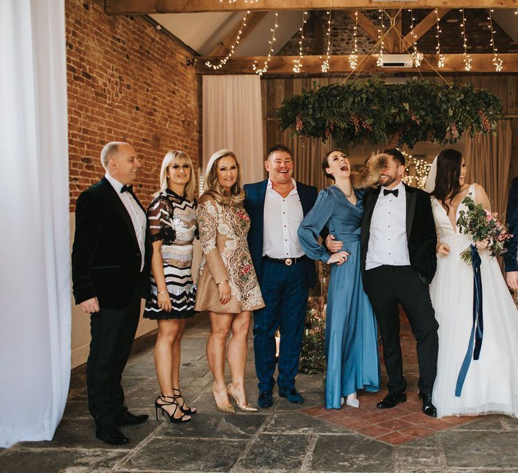 Bride and groom with wedding guests at Healing Manor