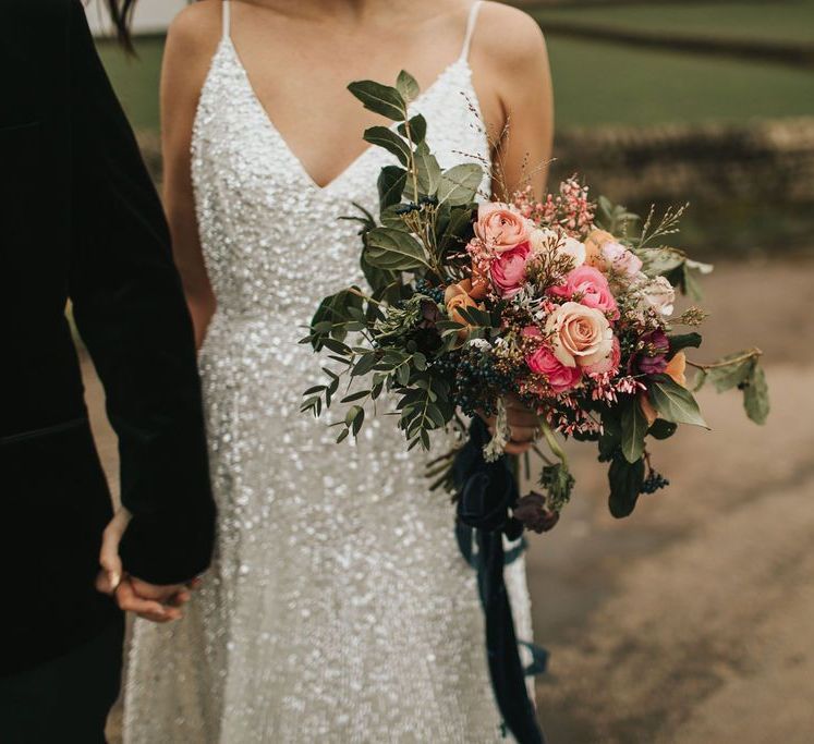 Sequin bride dress with pink bouquet