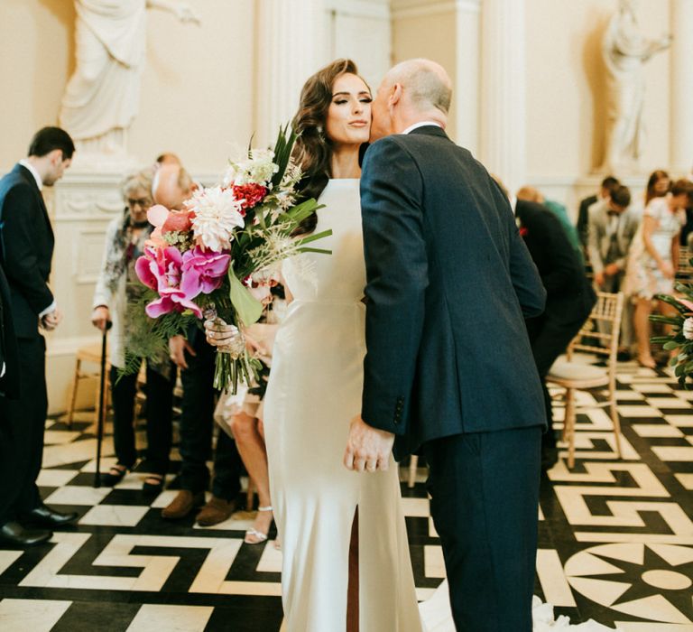 Father of The Bride Kissing His Daughter at the Altar