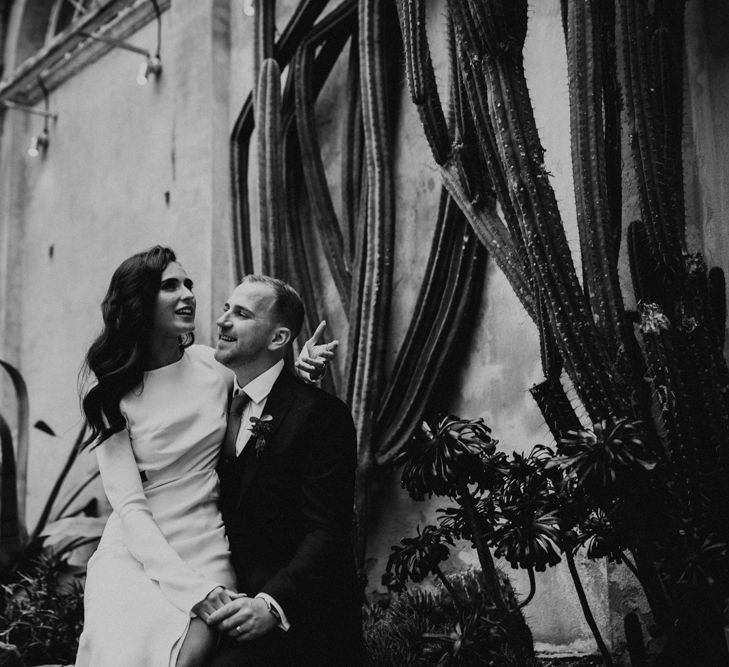 Bride Sitting on The Grooms Knee Talking