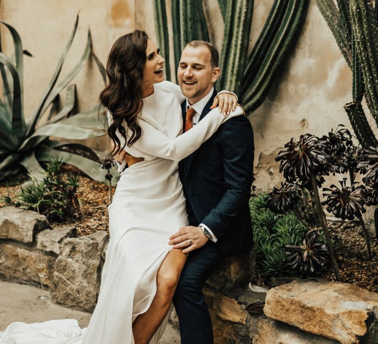 Bride and Groom Laughing and Embracing