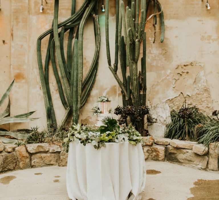 Wedding Cake Table with Botanical Plant Backdrop