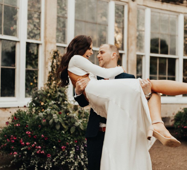 Groom Lifting His Bride Up