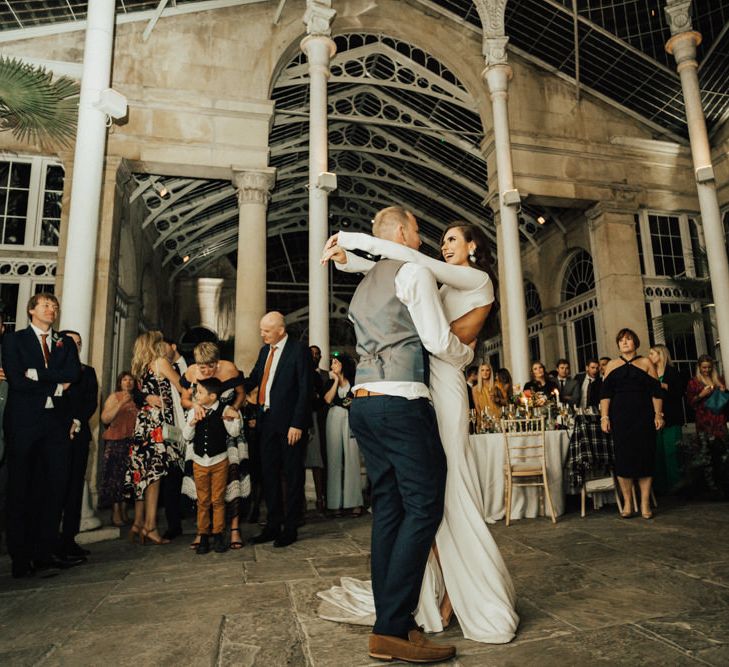 Bride and Groom Embracing During Their First Dance