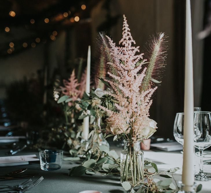 Pink Astilbe And Tall Tapered Candles For Wedding Reception