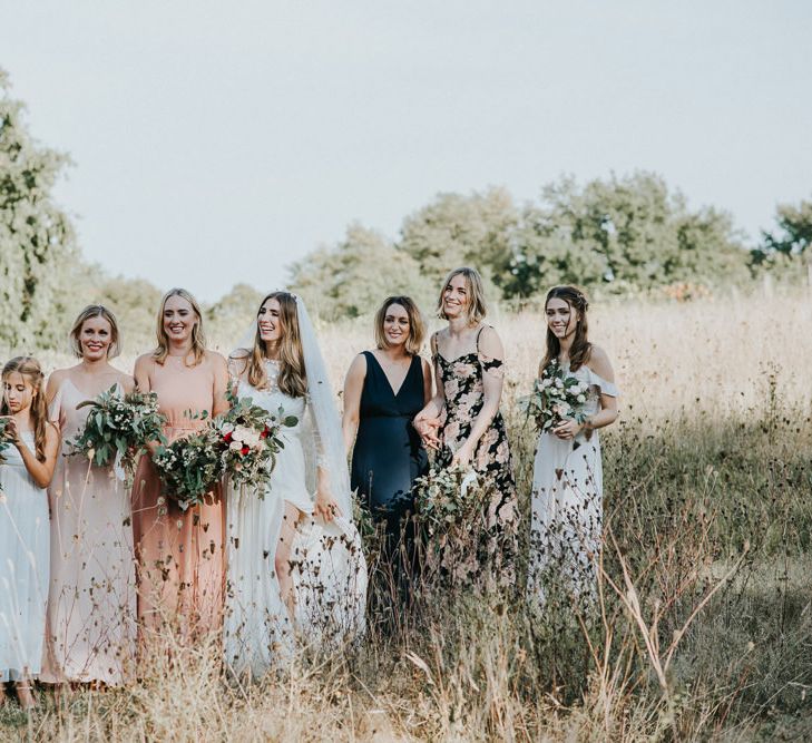 Bridal Party In Peach And Ink Coloured Dresses By Rewritten And Reformation