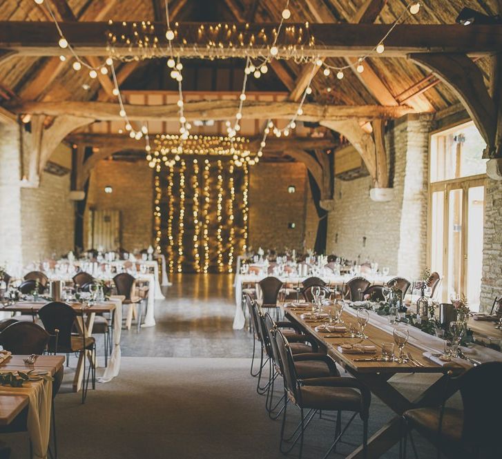 Beautiful rustic wedding venue Tythe Barn with fairy lights