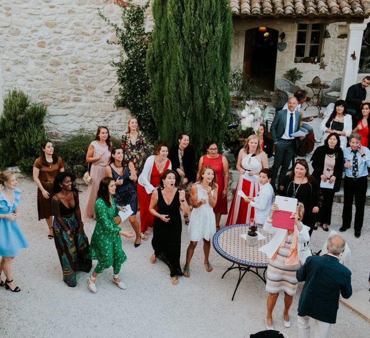 Wedding Guests Gathered in Provence Wedding Venue Courtyard