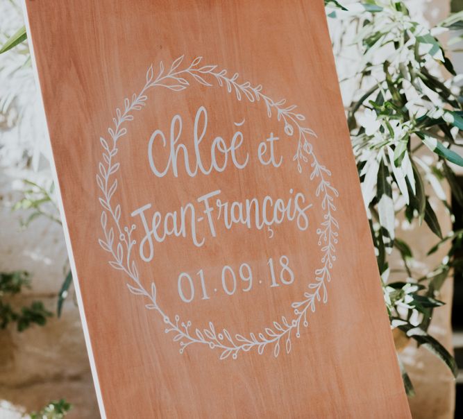 Wooden Wedding Welcome Sign with White Calligraphy and Laurel Design