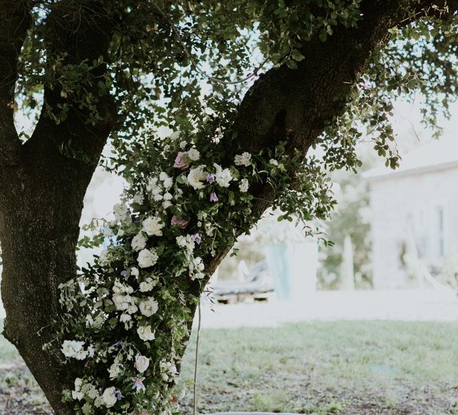 Tree Decorated in Flowers and Cream Love Seat