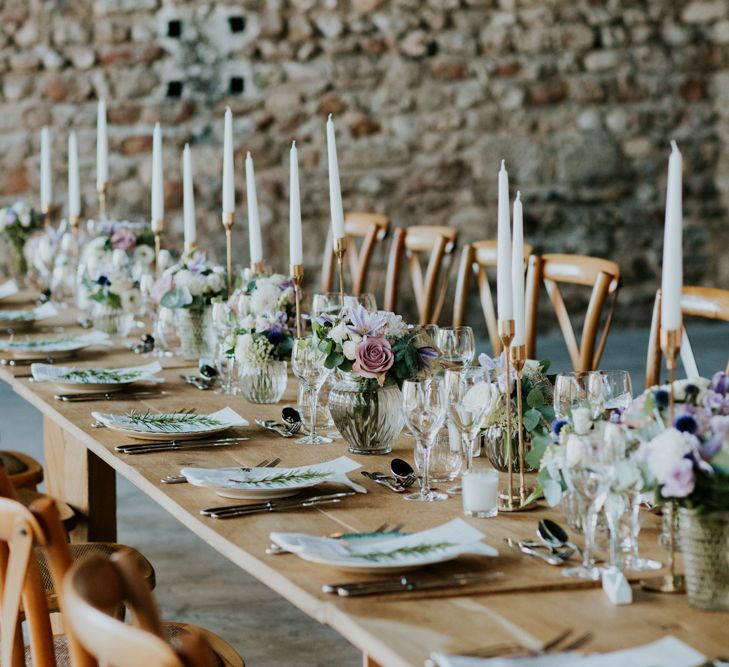 Rustic Reception Wedding Decor with Lilac Floral Centrepieces and Taper Candles