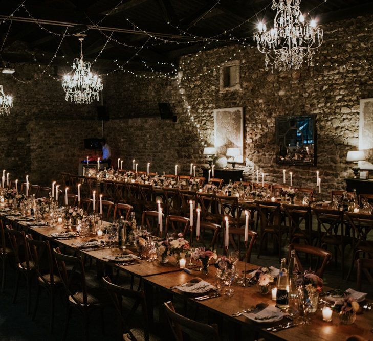 Barn Reception with Chandeliers, Fairy Lights and Candles Wedding Decor