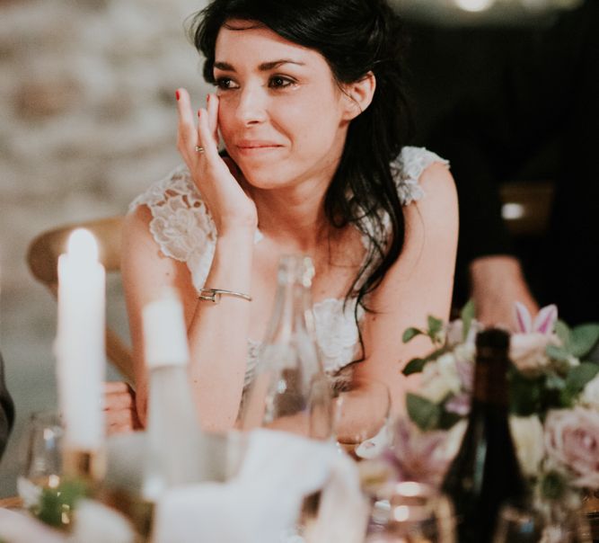 Beautiful Bride Wiping a Tear During Wedding Reception Speeches