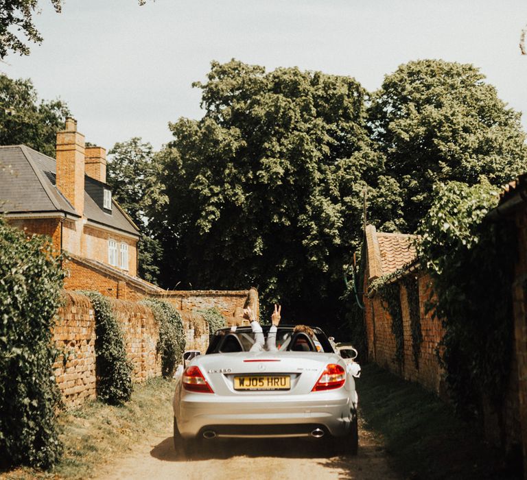 Groom Driving to Wedding Ceremony | Outdoor Ceremony at Fishley Hall with Grace Loves Lace Fringe Dress | Darina Stoda Photography