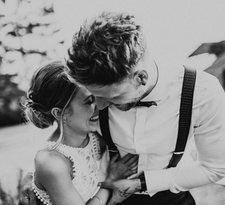 Bride in Embroidered Grace Loves Lace Gown with Fringing and Cut Out Back | Groom in Black Gagliardi Suit with Bow Tie and Braces | Outdoor Ceremony at Fishley Hall with Grace Loves Lace Fringe Dress | Darina Stoda Photography