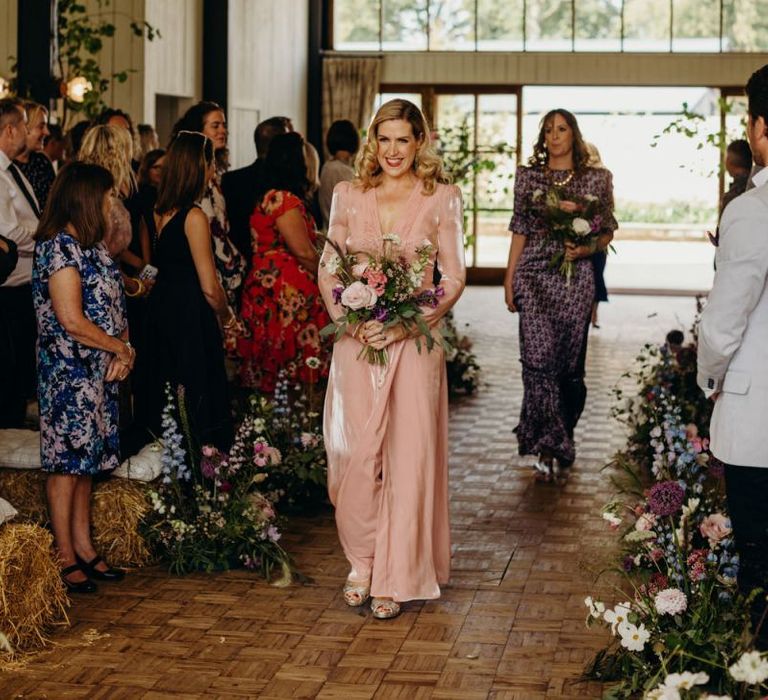 Bridesmaid in Blush Pink Dress Walking Down the Aisle