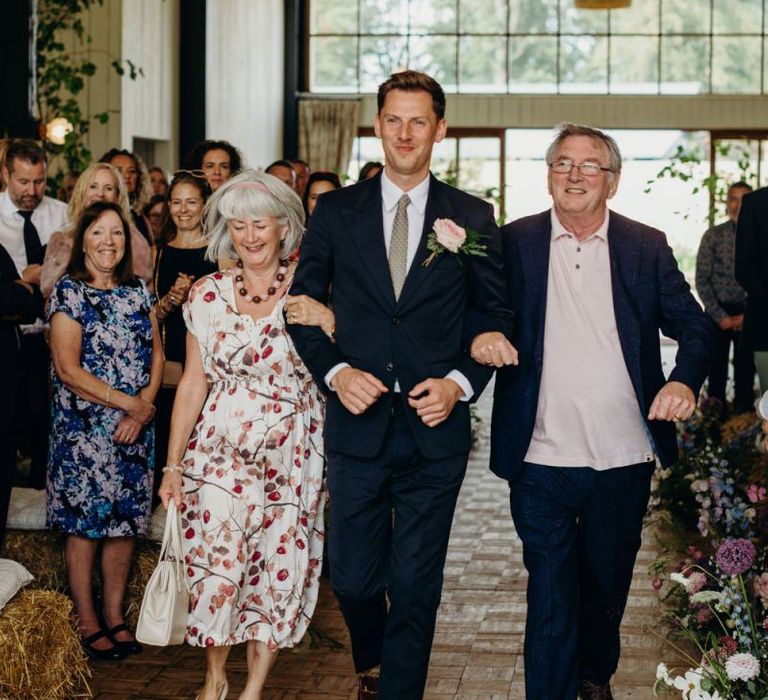 Groom Entrance with His Parents at Soho Farmhouse Wedding Ceremony