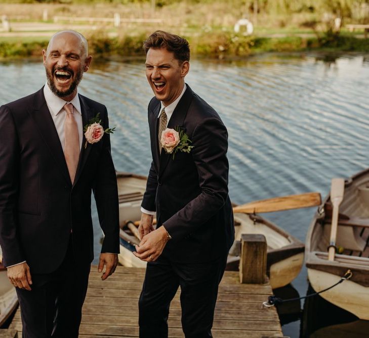 Mr and Mr Laughing by the boats