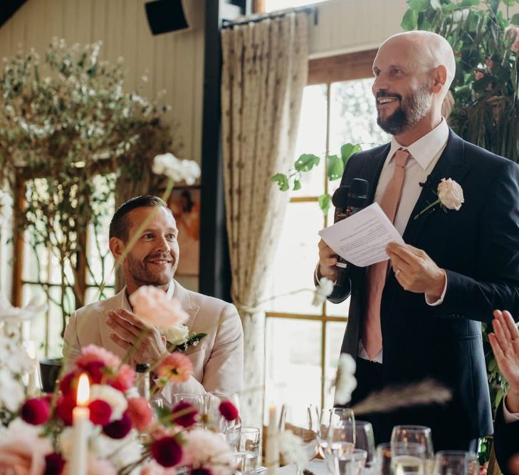 Groom in Navy Suit Reading His Wedding Speech