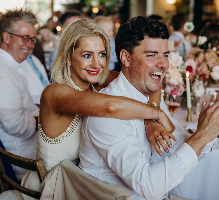 Guests Embracing During Wedding Speeches