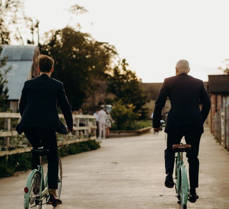 Grooms Cycling at Soho Farmhouse wedding