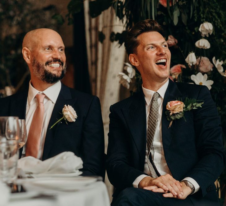 Grooms Laughing During the Speeches