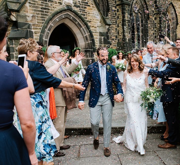 Confetti Exit | Bride in Delphine Manivet Gown | Groom in Navy Blazer &amp; Grey Trousers | Fun Stretch Tent Reception on Primary School Field in Sheffield |  Tub of Jelly Photography