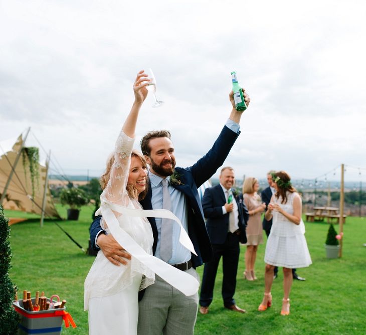 Bride in Delphine Manivet Gown | Groom in Navy Blazer &amp; Grey Trousers | Fun Stretch Tent Reception on Primary School Field in Sheffield |  Tub of Jelly Photography