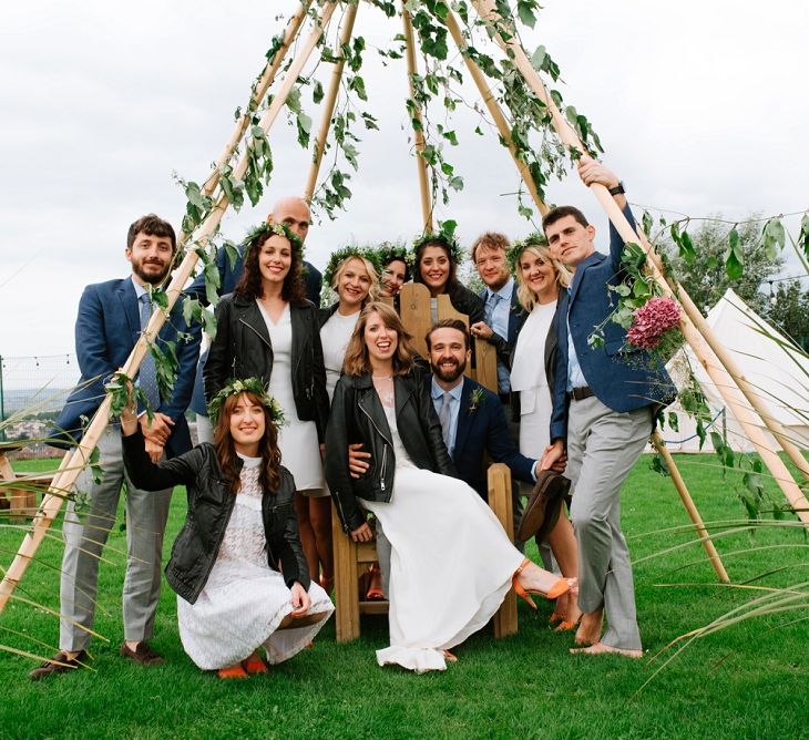 Wedding Party with Leather Jackets | Naked Tipi Wedding Decor | Bride in Delphine Manivet Gown | Groom in Navy Blazer &amp; Grey Trousers | Fun Stretch Tent Reception on Primary School Field in Sheffield |  Tub of Jelly Photography