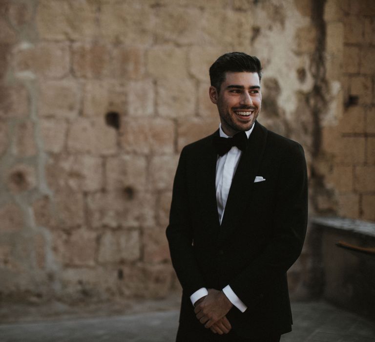 Groom in Made to Measure Tuxedo Suit by Oscar Hunt | Black Aquila Shoes | Intimate Italian Castle Wedding with Prosecco Tower | James Frost Photography