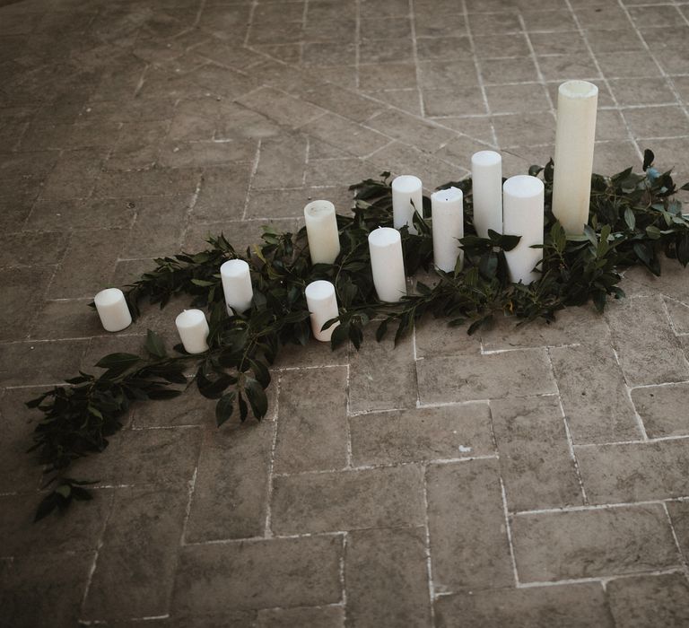 Wedding Decor | White Pillar Candles | Foliage | Intimate Italian Castle Wedding with Prosecco Tower | James Frost Photography