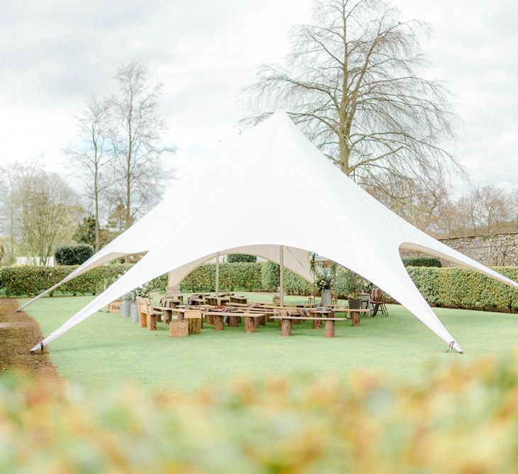 Ceremony on The Lawn with Benches and Stretch Tent Canopy