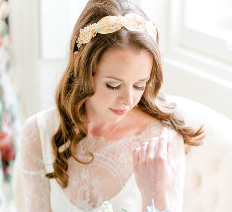 Beautiful Bride on the Wedding Morning Looking at Her Bouquet