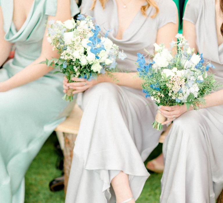 Bridesmaids Sitting at the Wedding Ceremony in their Satin Dresses