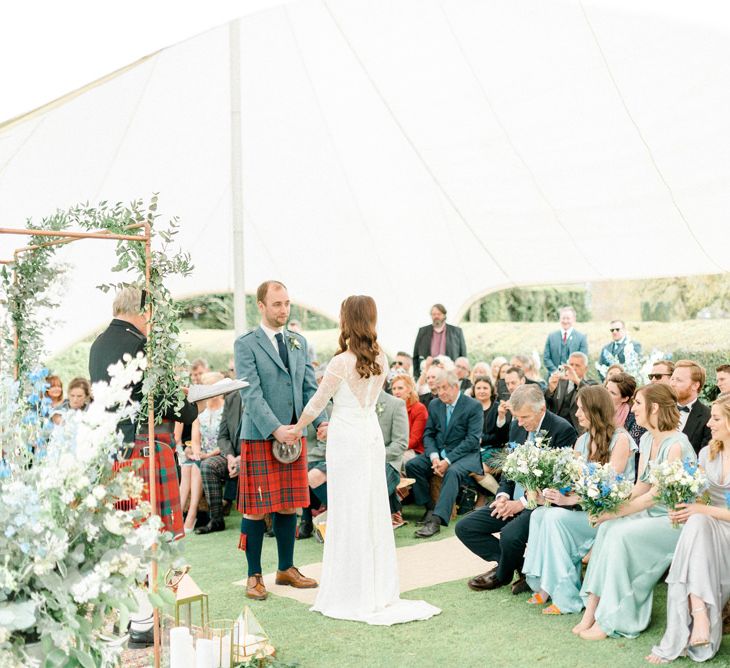 Bride and Groom Saying Their Vows at Their Outdoor Wedding Ceremony