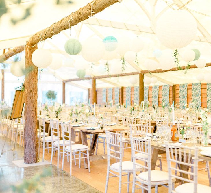 Green and White Barnquee Wedding Reception Decor with Hanging Paper Lanterns