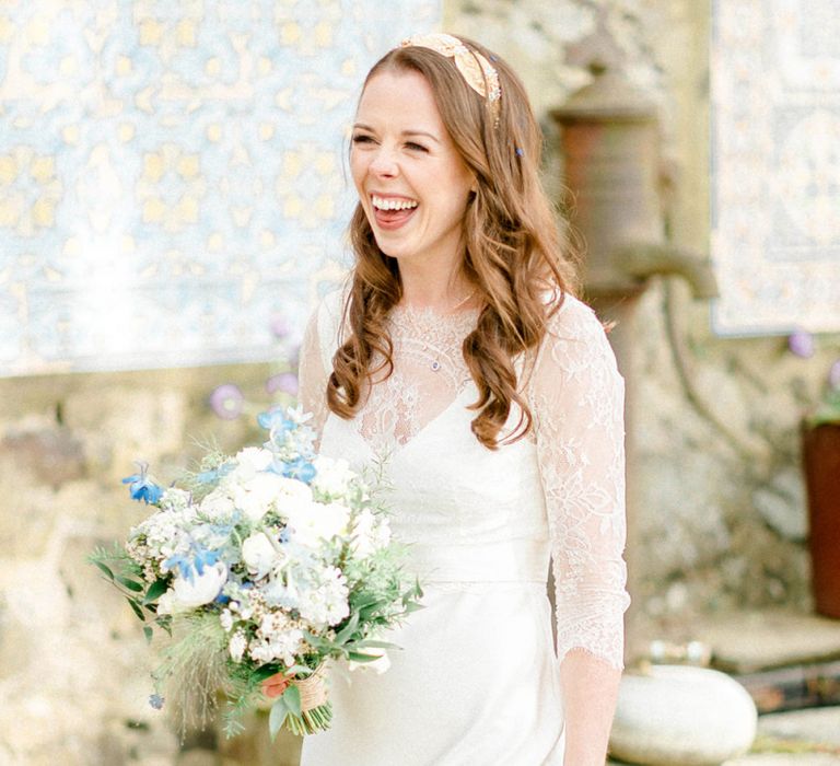 Beautiful Bride in Lace Charlie Bread Wedding Dress and Blue and White Wedding Bouquet