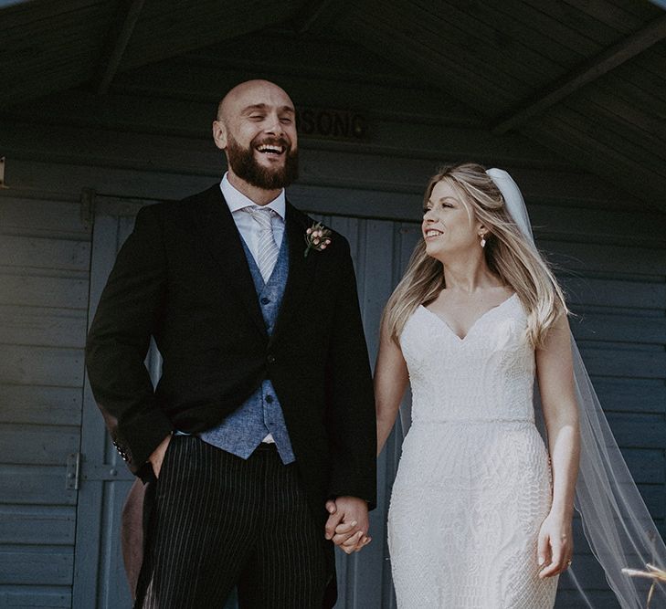 Wind Swept Bride &amp; Groom with Bride in Blush Coloured Dress