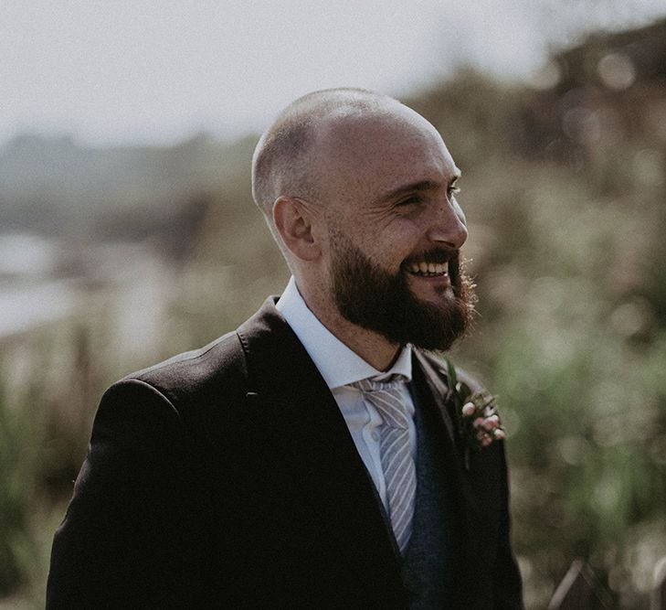 Groom at Beach Wedding with Floral Button Hole