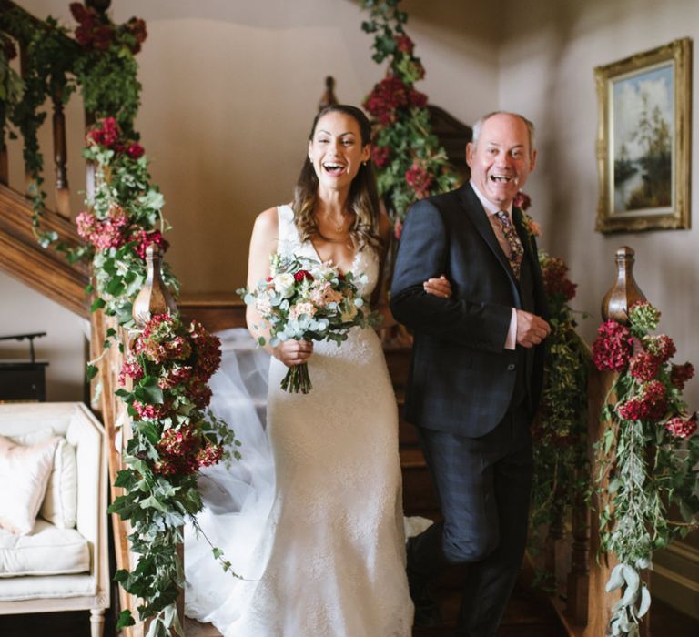 Bride and Father of The Bride Walk Down the Floral Decorated Staircase