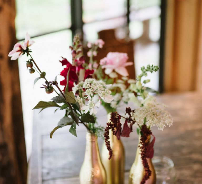 Wild Flowers in Gold Spray Painted Bottles