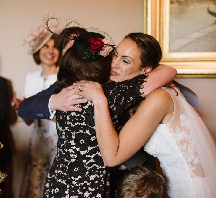 Bride and Wedding Guest Hugging