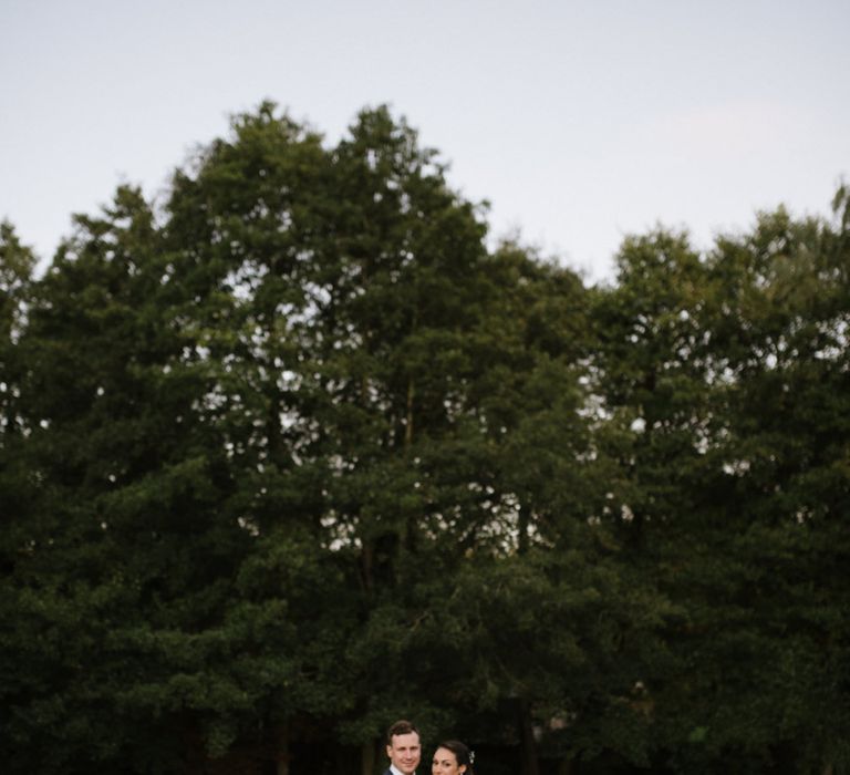 Bride and Groom Portrait on River Dock