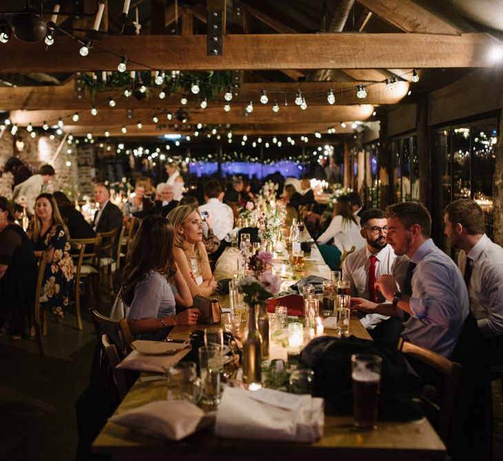 Guests at Wedding Reception with Romantic Candle Light