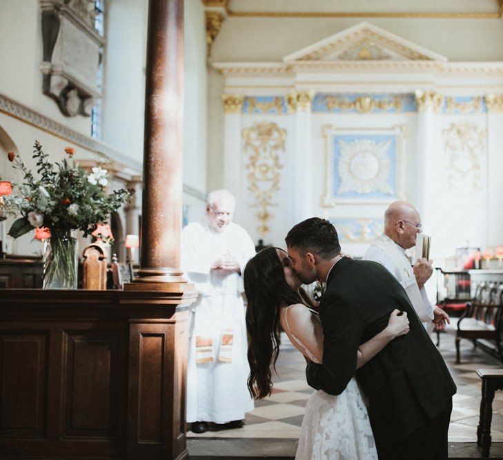 Bride And Groom Kiss As Husband and Wife