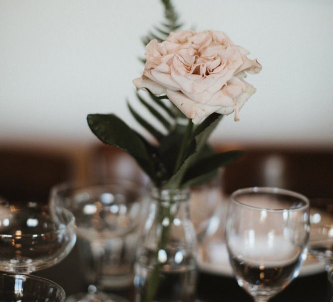 Single Pink Rose Stem in Glass Bottle