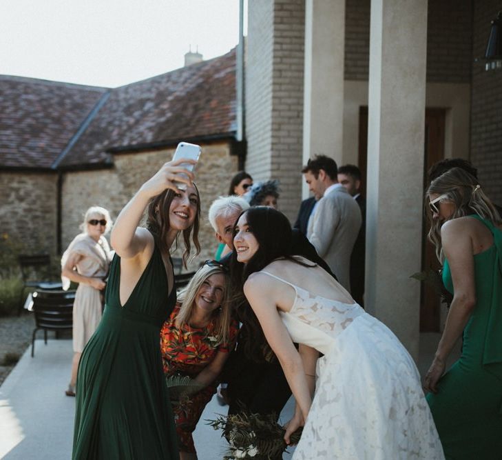 Wedding Guests Take a Selfie With The Bride