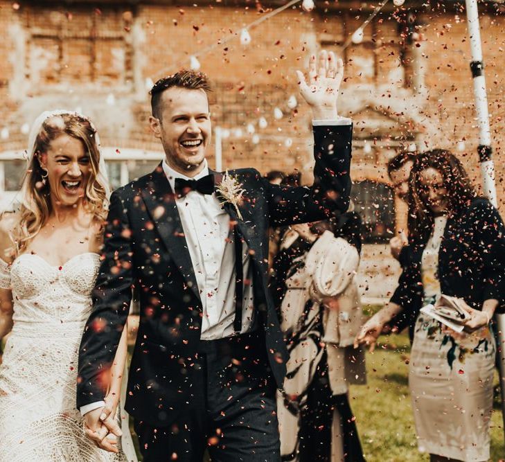 Confetti Exit with Boho Bride in Rue De Seine Wedding Dress and Groom in Black Tie Suit